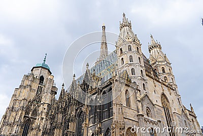 Saint Stephen`s Cathedral Stephansdom. Colorful roof and tower. Archtecture photo. Wien. Vienna. Austria. Stock Photo