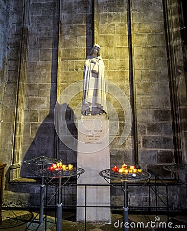 Saint Therese statue inside of Notre-Dame de Paris cathedral, Paris Editorial Stock Photo