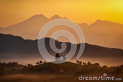 Saint Thomas Church during Sunrise in the Slovenian Moutains Stock Photo