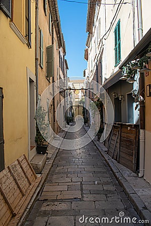 Saint Trope narrow street with plants Stock Photo