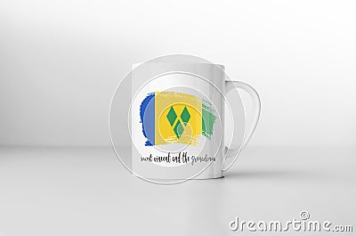 Saint Vincent and the Grenadines flag on white coffee mug. Stock Photo