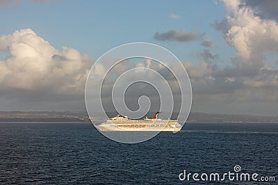 Saint Vincent and the Grenadines - May 11, 2020: Shot of Carnival Valor anchored at sea off the coast of Saint Vincent island. Editorial Stock Photo