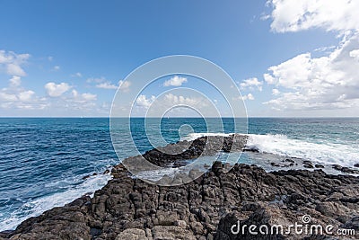 Sainte-Anne, Martinique - Waves in the blue eye hole oeil bleu in FerrÃ© Cape Stock Photo