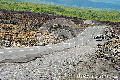 People enjoy the view from the asphalt road over volcanic lava of Piton de la fournaise volcano in Sainte-Rose De La Reunion, Fran Editorial Stock Photo