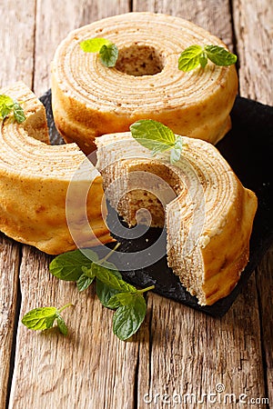Sakotis, raguolis, sekacz delicious Polish and Lithuanian cake decorated with mint close-up. vertical Stock Photo