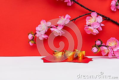 Sakura Blossom, Golden Ingot on top of Red Envelope Stock Photo