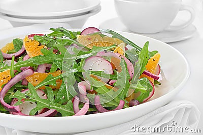 Salad with arugula, radish and tangerine Stock Photo