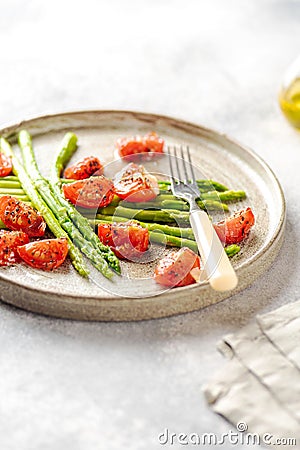 Asparagus with tomatoes Stock Photo