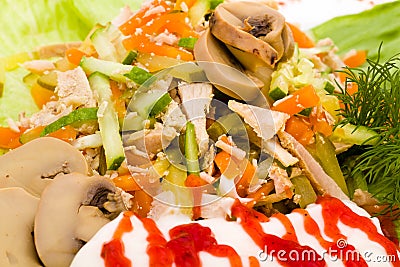 Salad with assorted greens, fried pork, carrots Stock Photo