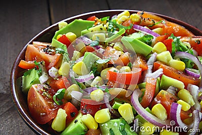 Salad with avocado, tomato, paprika and corn Stock Photo