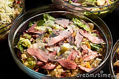 Salad with bacon meat slices lettuce leaves fresh paprika tomatoes Stock Photo