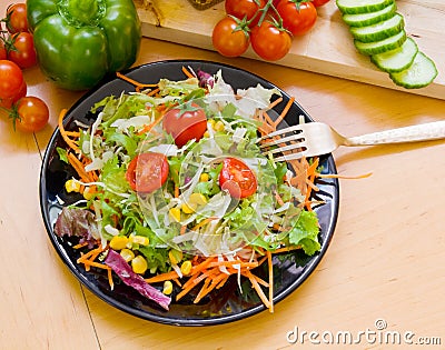 Salad on black dish Stock Photo