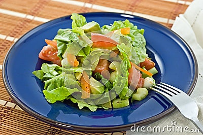 Salad on blue plate Stock Photo