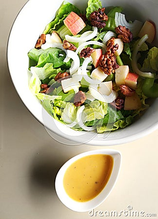 Salad in bowl with dressing Stock Photo