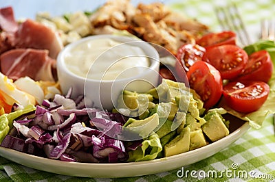 Salad cobb- avocado, tomatoes, bacon, chicken and onion. Stock Photo