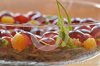 Salad in a glass dish. Rocket salad with grapes Stock Photo