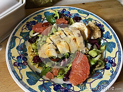 Salad with grapefruit and chicken in mustard marinade. Stock Photo