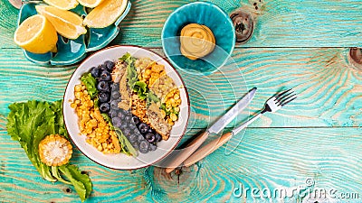 Salad of healthy ingredients chicken, corn, lemon, mustard blueberries. healthy food concept, catering Stock Photo