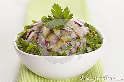 Salad with herring, red onion, white bean and pickled cucumber Stock Photo