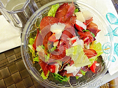 Salad with parma ham top view plate Stock Photo