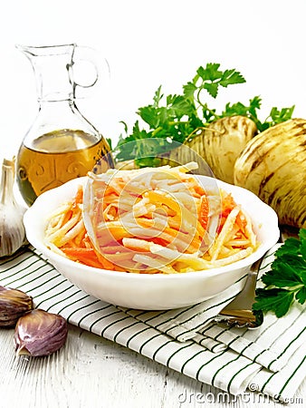 Salad of parsnip and carrot on table Stock Photo