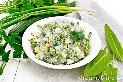 Salad with potatoes and sorrel on wooden table Stock Photo