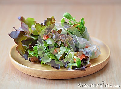 Salad rool healthy food on wooden plate Stock Photo