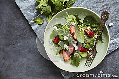 Salad with Spinach, strawberry, feta and pumpkin seeds Stock Photo