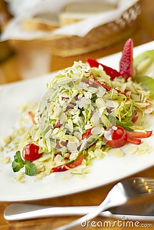 Salad with strawberry, kiwi and almonds Stock Photo