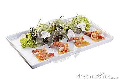 Salad with tiger shrimp with the original sauce. On a white background Stock Photo