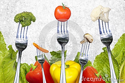 Salad vegetables on forks Stock Photo