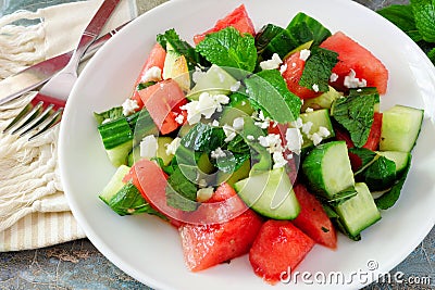 Salad with watermelon, mint, cucumber and feta, close up Stock Photo