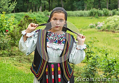 Salaj, Romania-May 15, 2018: outdoor portrait of a young girl wearing traditional Romanian costume Editorial Stock Photo