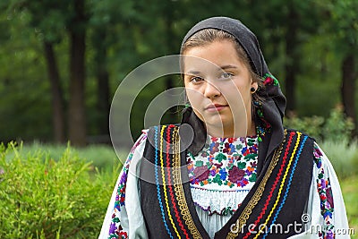 Salaj, Romania-May 15, 2018: outdoor portrait of a young girl wearing traditional Romanian costume Editorial Stock Photo