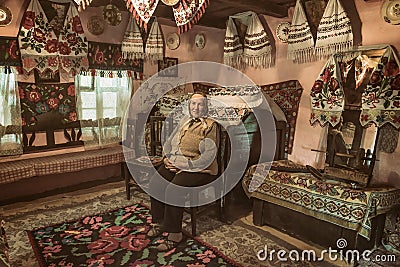 Salaj, Transylvania, Romania-May 15, 2018: old local woman inside her beautiful traditional house in the countryside Editorial Stock Photo