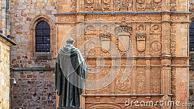 Salamanca, Spain, November 15, 2023. Plateresque doorway of the University of Salamanca and statue of Fray Luis de Leon. Editorial Stock Photo