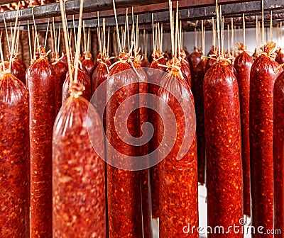 Salami hanging on a rope Stock Photo