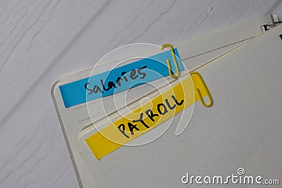 Salaries Payroll text on sticky notes with office desk Stock Photo