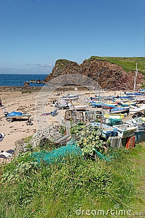 Hope Cove Devon England. Small boats moored on the beach. Cl Editorial Stock Photo