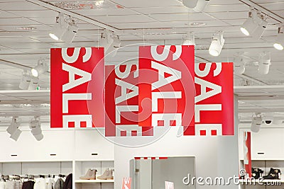 Sale signs in a clothing store Stock Photo