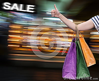 Sale. Hand with shopping bags Stock Photo