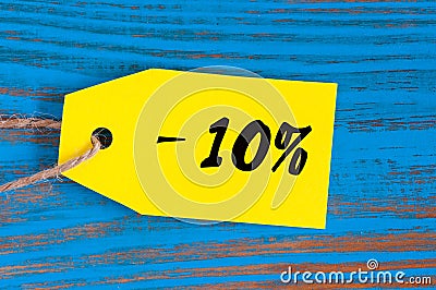 Sale minus 10 percent. Big sales ten percents on blue wooden background for flyer, poster, shopping, sign, discount Stock Photo