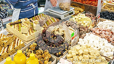 Sale of oriental sweets and ceramic tableware at the fair. Editorial Stock Photo