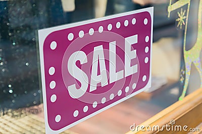 Sale sticker on wondow shop. Season discount shopping Stock Photo