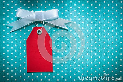 Sale tag on blue polka-dot tablecloth Stock Photo