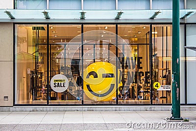 Sale yellow sign at mall. Discount concept. Market interior design. Selling business model. Lifestyle promotion. Store promo Editorial Stock Photo