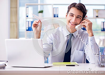 The sales agent working in travel agency Stock Photo