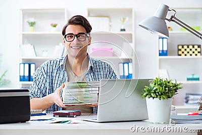 The sales assistant at publishing house showing ready printed books Stock Photo