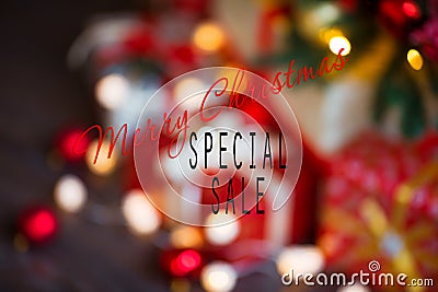 Sales on Christmas and New Year holidays. Blurred Festive decoration with informative inscription of discount for shop Stock Photo