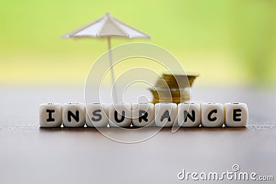 Sales insurance home , car, family concept / White umbrella protecting gold coin security of property insurance claim Stock Photo